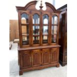 A MAHOGANY CABINET WITH FOUR LOWER AND FOUR UPPER GLAZED DOORS