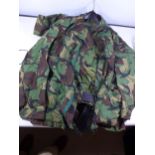 A CAMOUFLAGE SMOCK COMBAT UNIFORM, SIZE S COMPRISING OF A COAT AND TROUSERS, HAT ETC ALSO A