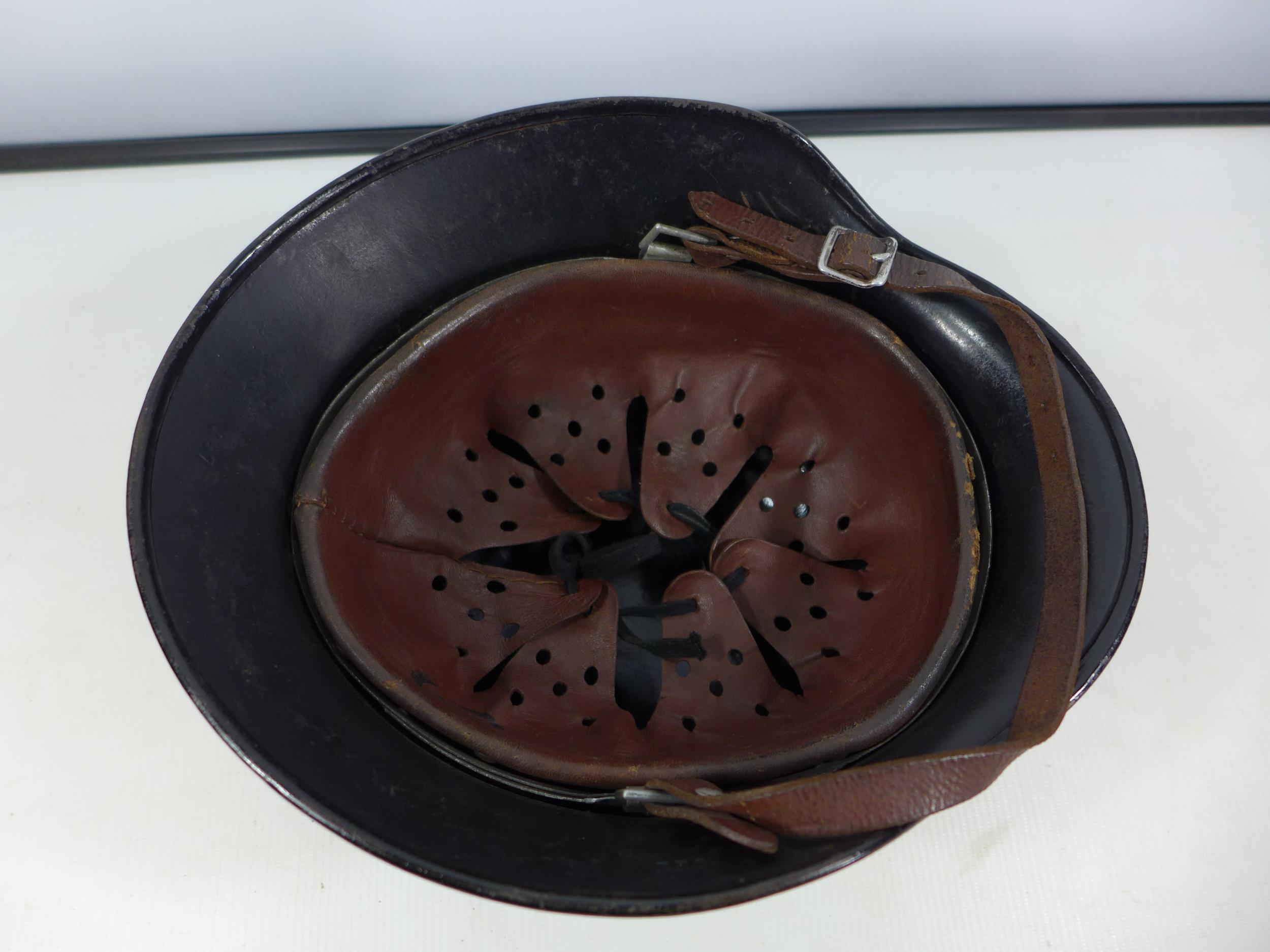 A GERMAN BLACK PAINTED METAL HELMET WITH SS RUNES AND SWASTIKA DECALS - Image 3 of 8