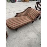 A VICTORIAN MAHOGANY CHAISE LONGUE ON TURNED AND FLUTED LEGS