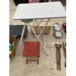 A FOLDING SHELVING UNIT AND A STOOL