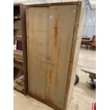 A VINTAGE METAL TWO DOOR STORAGE CUPBOARD