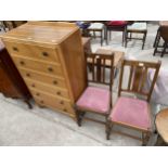 A MID 20TH CENTURY LIGHT OAK CHEST OF SIX DRAWERS 30" WIDE AND A PAIR OF OAK DINING CHAIRS