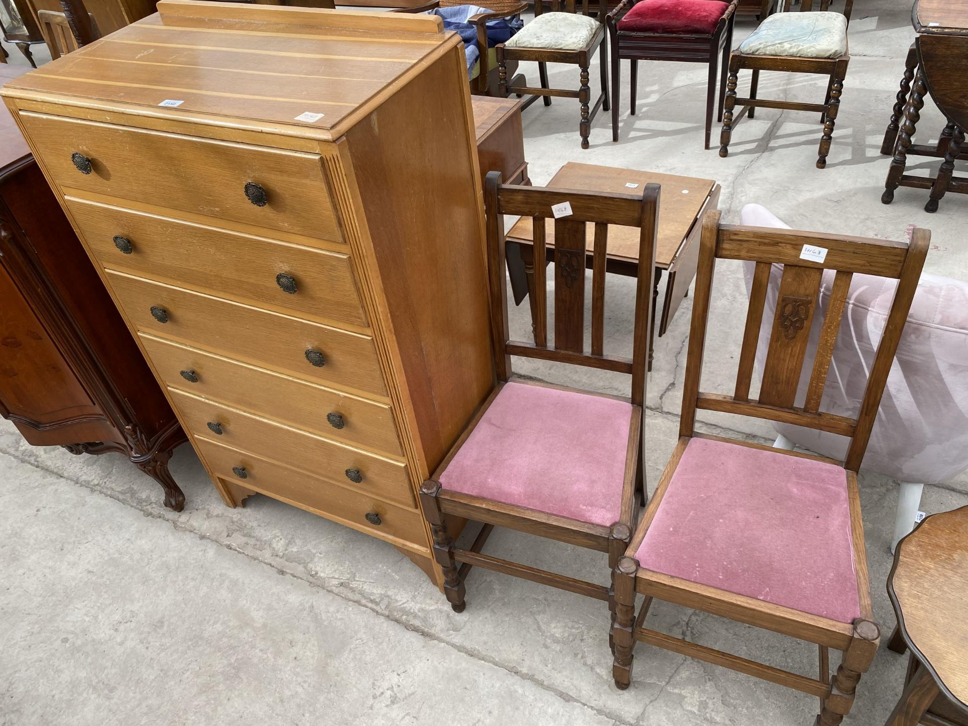 A MID 20TH CENTURY LIGHT OAK CHEST OF SIX DRAWERS 30" WIDE AND A PAIR OF OAK DINING CHAIRS