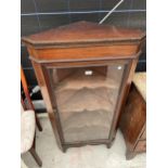 A MAHOGANY AND INLAID GLASS FRONTED CORNER CUPBOARD