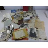 A COLLECTION OF WWII MEMORABILIA COMPRISING PHOTOS OF CAPTURED NAZI FLAG, WAR DIARY, MONEY ETC