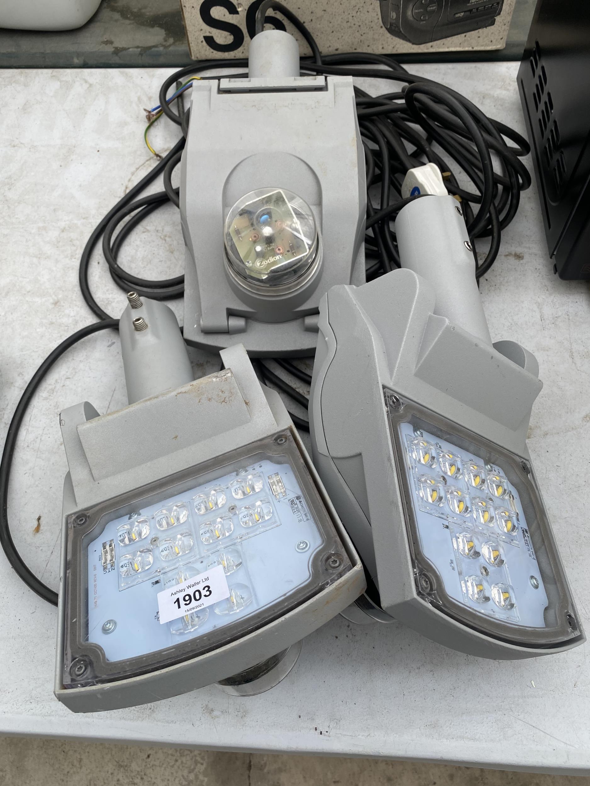 THREE INDUSTRIAL OUTSIDE SECURITY LIGHTS