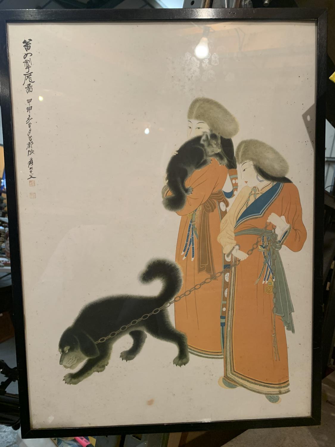 A FRAMED ORIENTAL PRINT