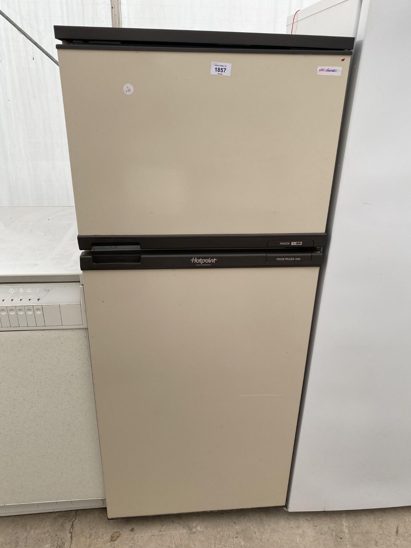 A CREAM HOTPOINT UPRIGHT FRIDGE FREEZER