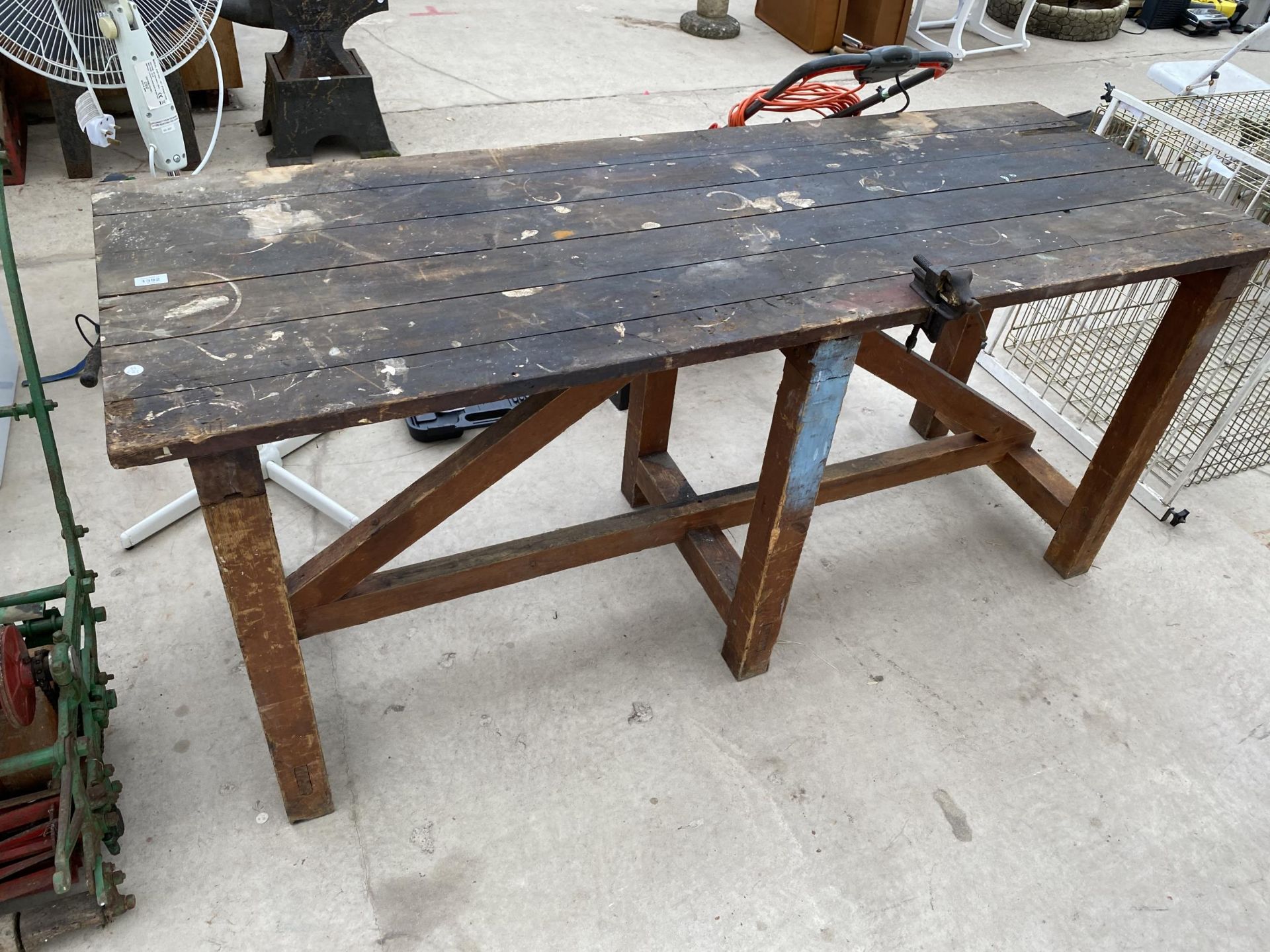 A VINTAGE BR WORKBENCH WITH A SMALL BENCH VICE