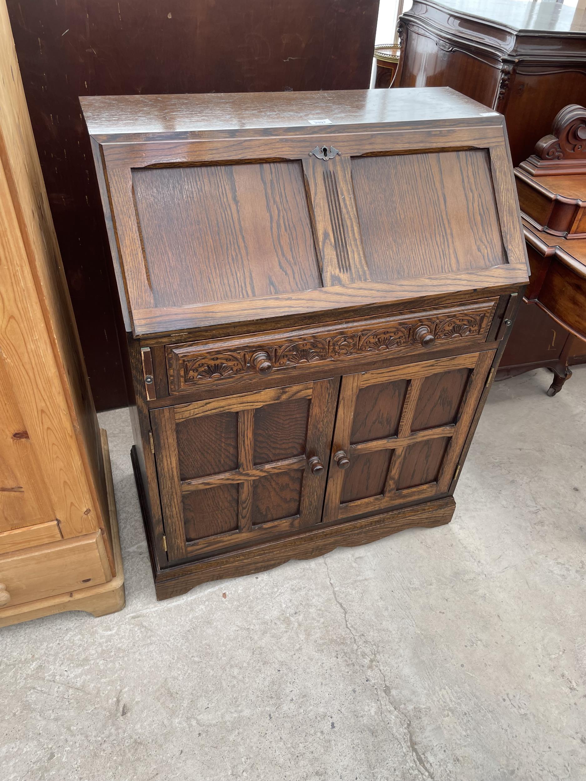 AN OAK BUREAU IN OLD CHARM STYLE 30" WIDE