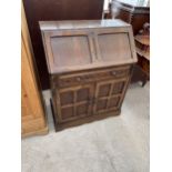 AN OAK BUREAU IN OLD CHARM STYLE 30" WIDE