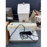 A RETRO SINGER SEWING MACHINE WITH CARRY CASE