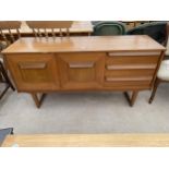 A RETRO TEAK SIDEBOARD BEARING LABEL 'STATEROOM BY STONEHILL', 54.5" WIDE
