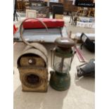 A VINTAGE ROAD LAMP AND A FURTHER VINTAGE PARAFIN LAMP