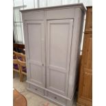 A PAINTED PINE TWO DOOR WARDROBE WITH TWO DRAWERS TO THE BASE W:56.5" H:88"