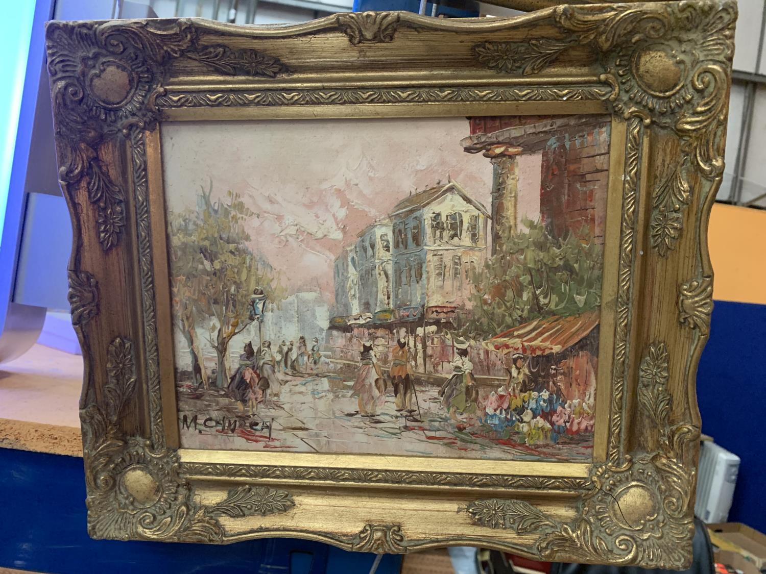 A GILT FRAMED OIL ON CANVAS OF A PARISIAN SCENE WITH INDISTINCT SIGNATURE 19CM X 24XM