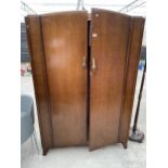 AN OAK MID 20TH CENTURY WARDROBE