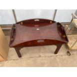 A GEORGIAN STYLE MAHOGANY COFFEE TABLE, IN THE FORM OF A BUTLERS TABLE, 41 X 29"