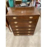 AN EARLY 20TH CENTURY STAINED PINE CHEST OF SIX DRAWERS WITH BRASS SCOOP HANDLES