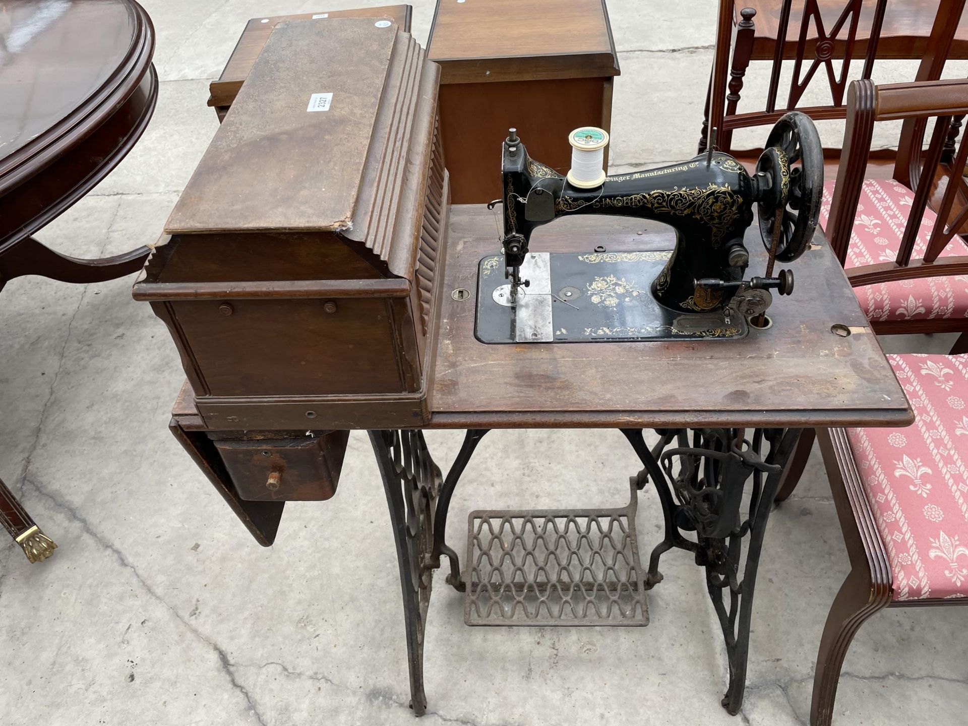 A SINGER TREADLE SEWING MACHINE