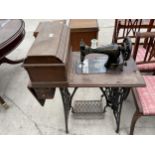 A SINGER TREADLE SEWING MACHINE