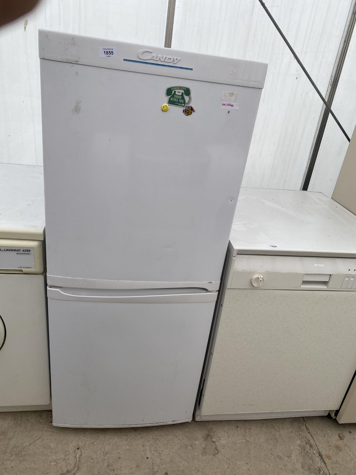 A WHITE CANDY UPRIGHT FRIDGE FREEZER