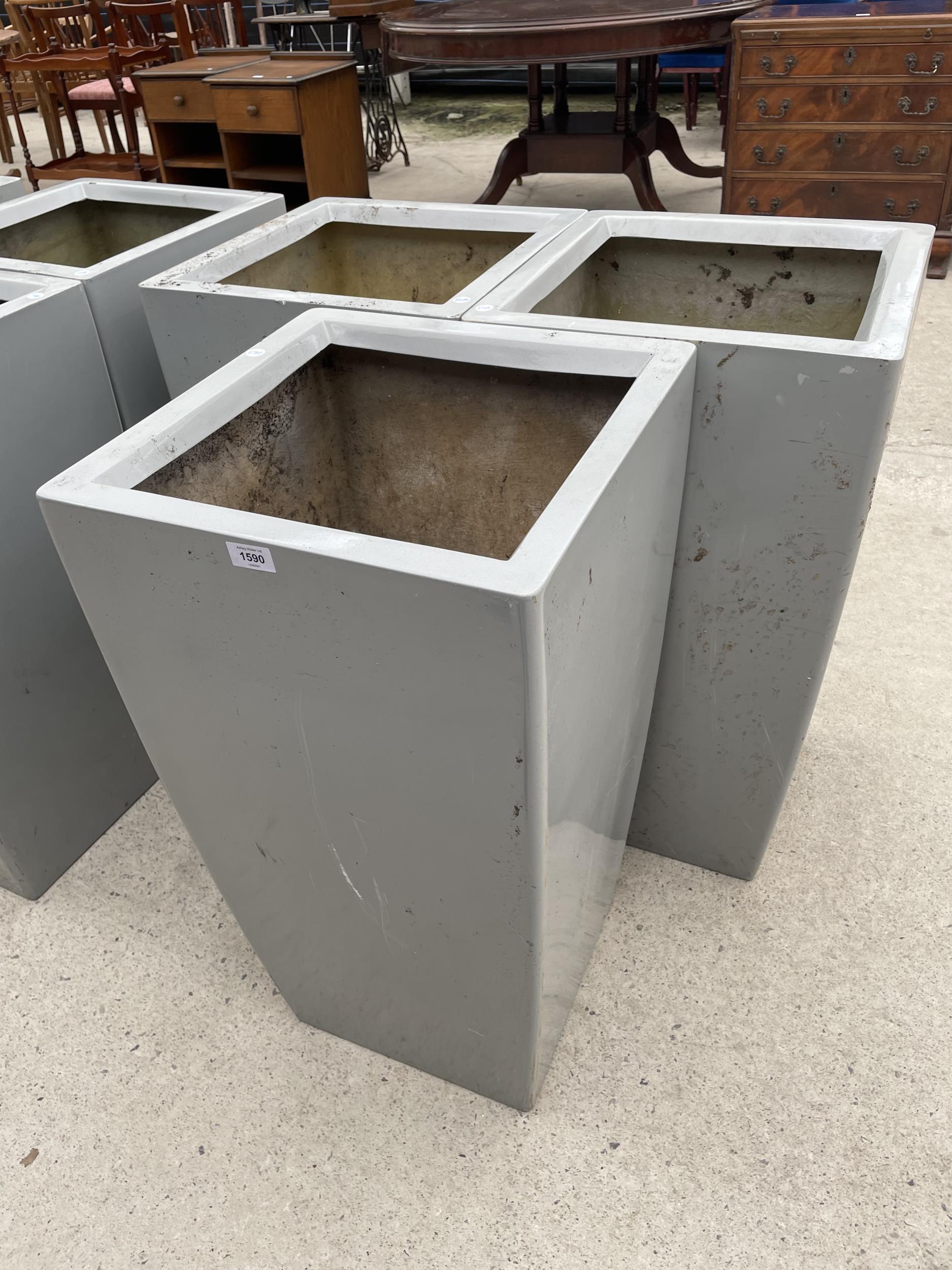 THREE LARGE GREY PLASTIC PLANTERS