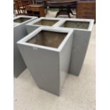 THREE LARGE GREY PLASTIC PLANTERS