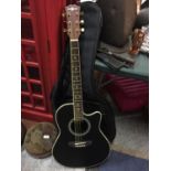 AN ACOUSTIC/ELECTRIC GUITAR AND CASE