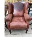 A WINGED LAURA ASHLEY LEATHER CHAIR ON FRONT CABRIOLE LEGS