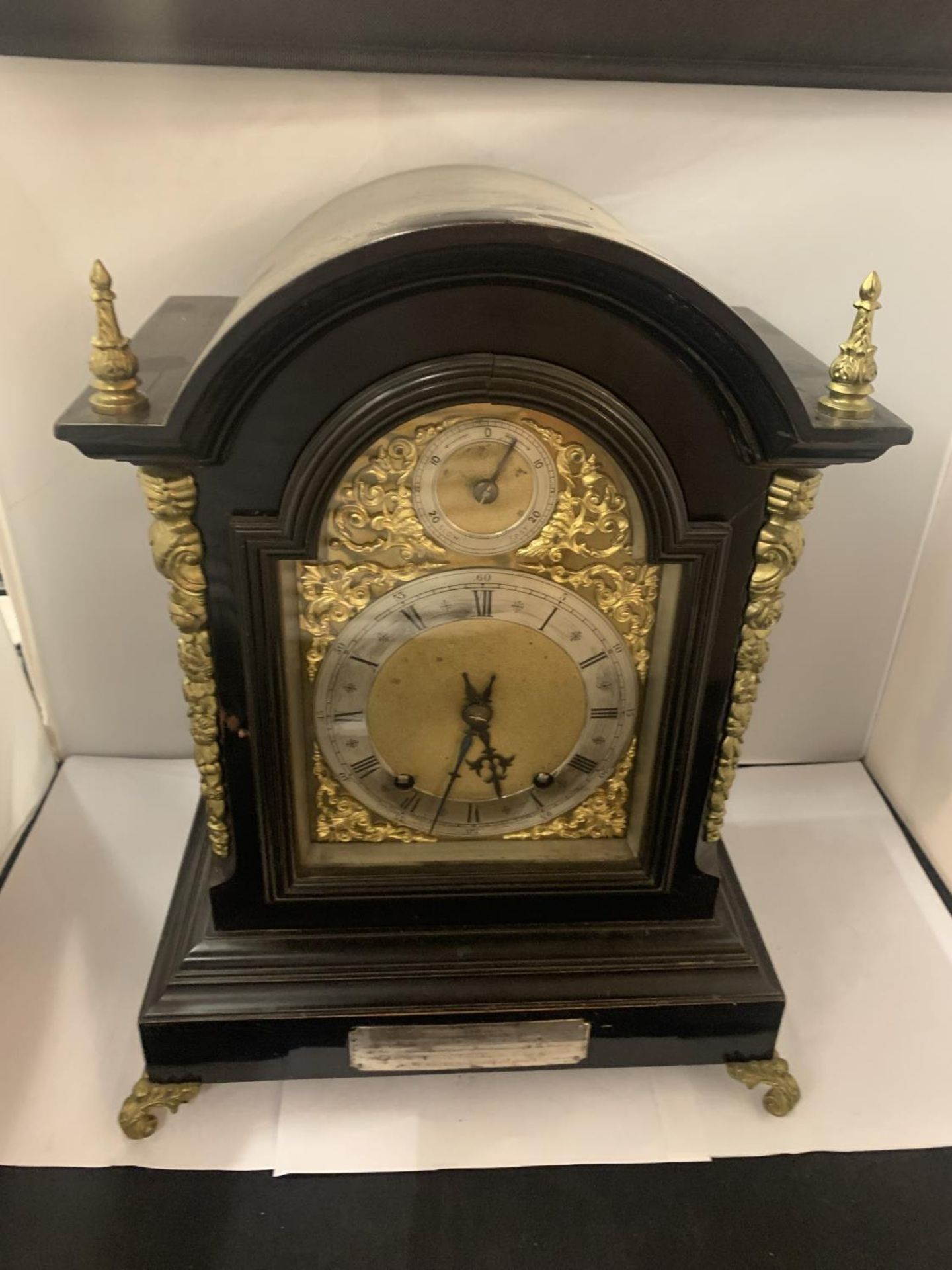 A VICTORIAN EBONISED BRACKET CLOCK WITH SILVERISED DIAL, GILDED DECORATION AND PIERCED SIDE