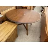 AN OVAL ERCOL STYLE DROP-LEAF DINING TABLE