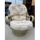 A DARO BAMBOO AND WICKER SWIVEL CONSERVATORY CHAIR