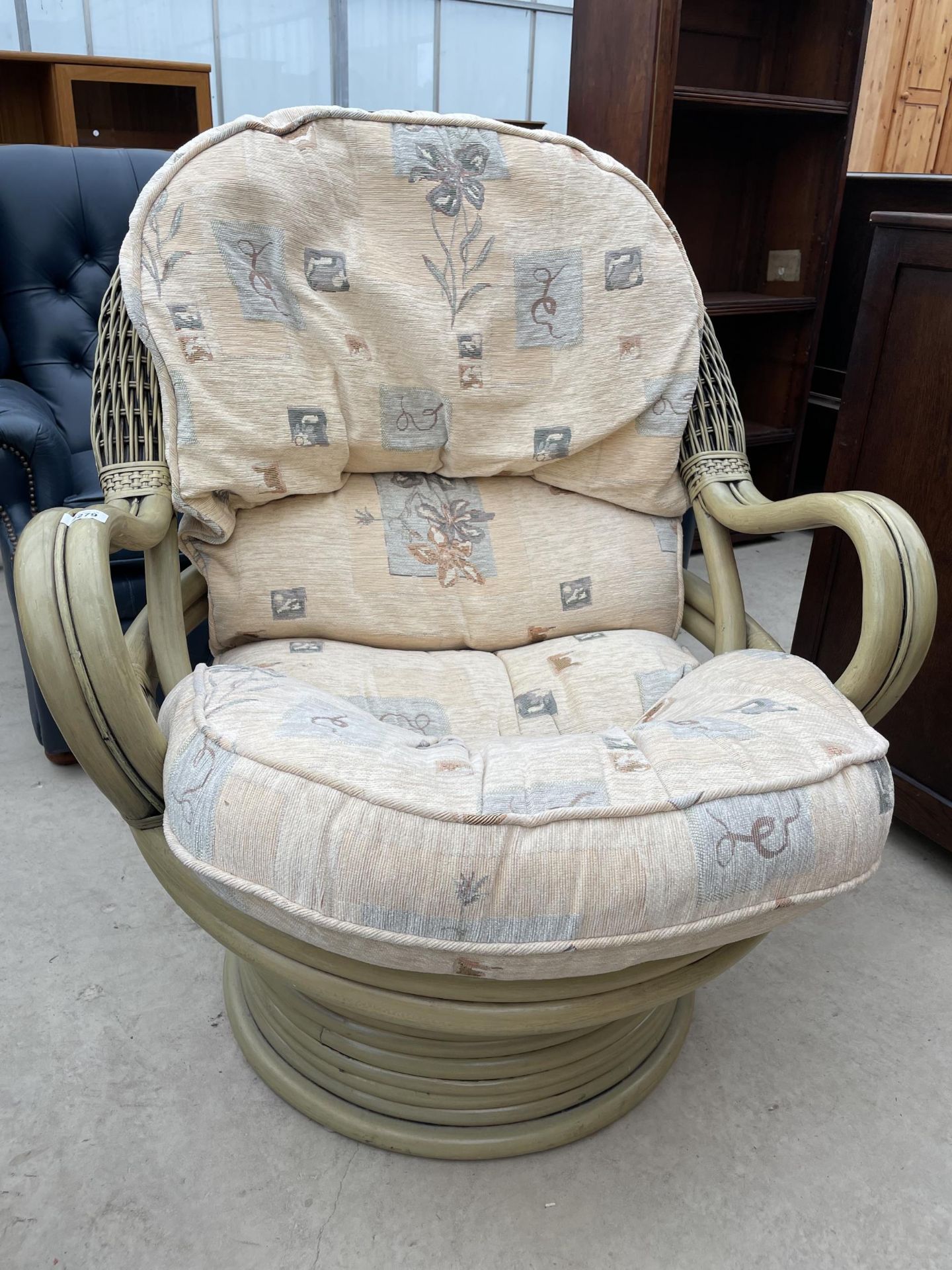 A DARO BAMBOO AND WICKER SWIVEL CONSERVATORY CHAIR