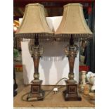 A PAIR OF DECORATIVE TABLE LAMPS WITH BEAD FRINGED LAMP SHADES
