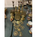 A VINTAGE COLLECTION OF BRASS ITEMS TO INCLUDE THREE LETTER RACK HOLDERS , SIX CANDLE STICK