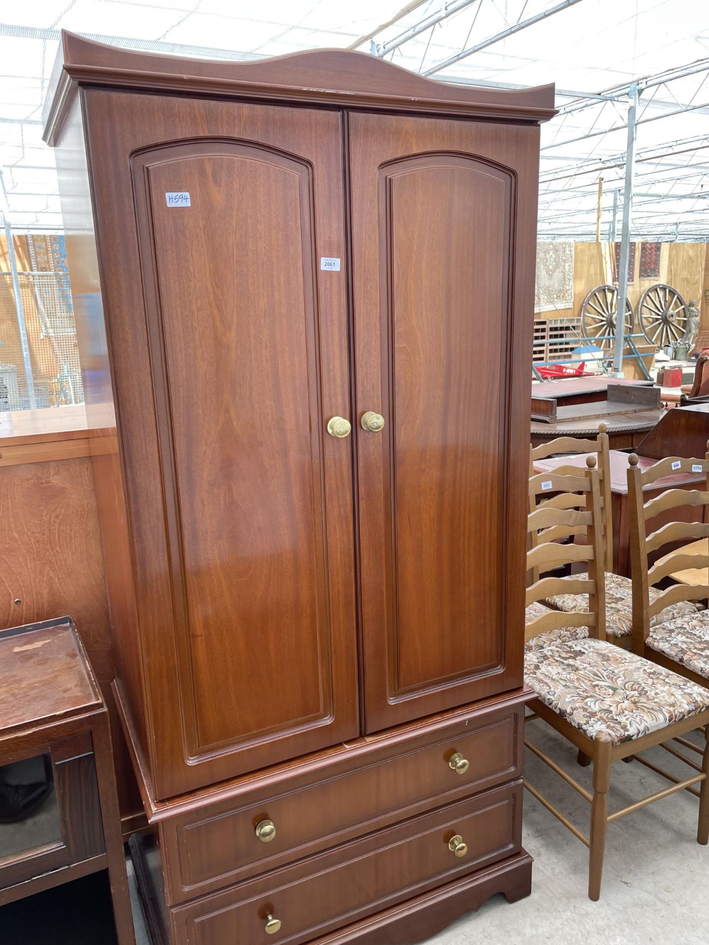 A MODERN MAHOGANY EFFECT TWO DOOR WARDROBE HAVING TWO DRAWERS TO THE BASE, 36"WIDE