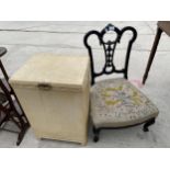 AN EBONISED NURSING CHAIR AND LLOYD LOOM STYLE OTTOMAN