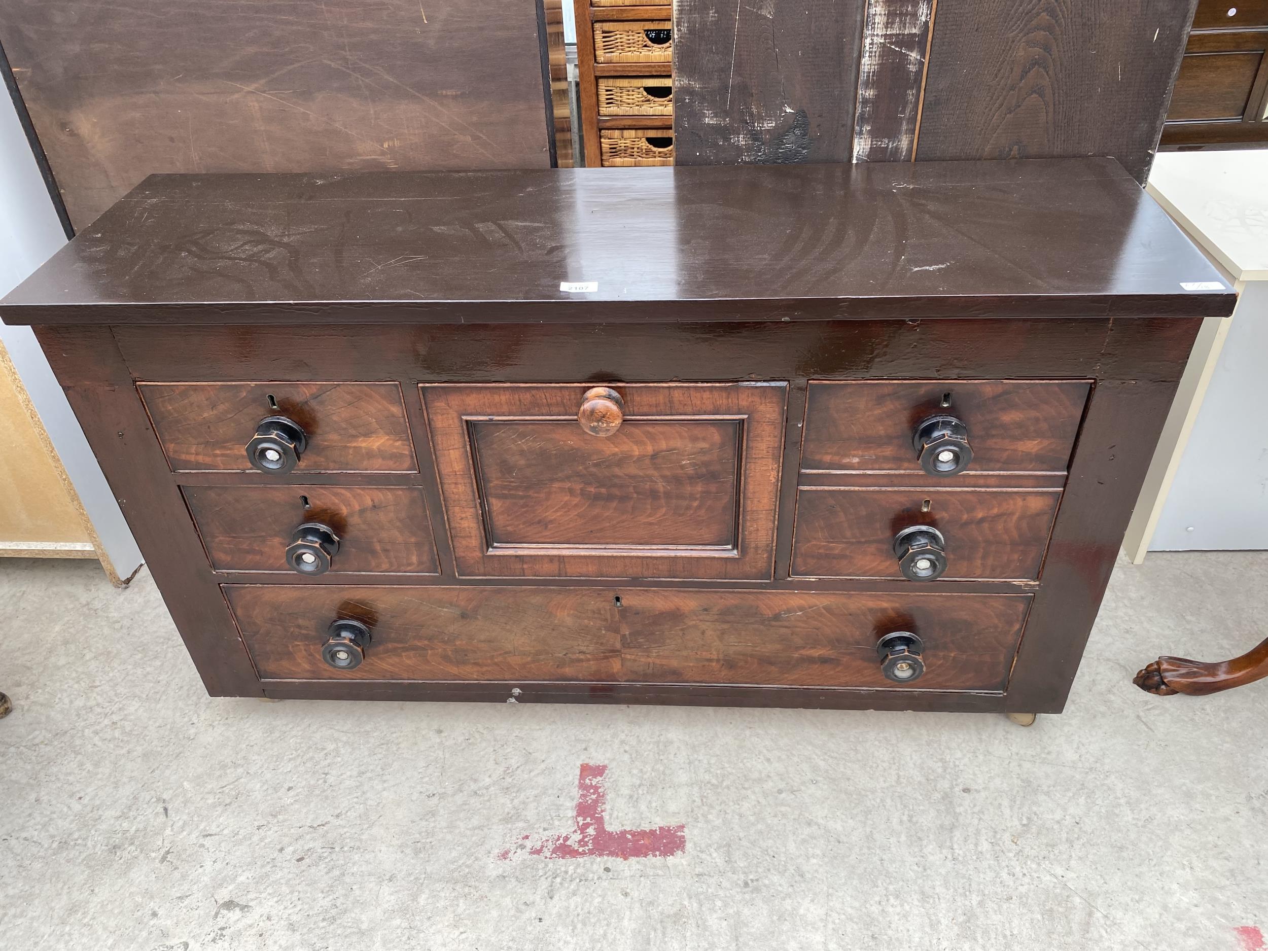 A MAINLY 19TH CENTURY MAHOGANY CHEST OF FOUR SHORT AND ONE LONG DRAWER AND A CENTRAL TOP HAT