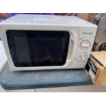 A WHITE PACIFIC MICROWAVE OVEN