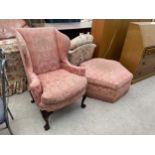 A GEORGIAN STYLE WINGED CHAIR ON CABRIOLE LEGS, WITH BALL AND CLAW FEET AND HEXAGONAL UPHOLSTERED