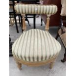 A VICTORIAN PINE CHILDS CHAIR WITH UPHOLSTERED TOP RAIL AND SEAT ON TURNED LEGS
