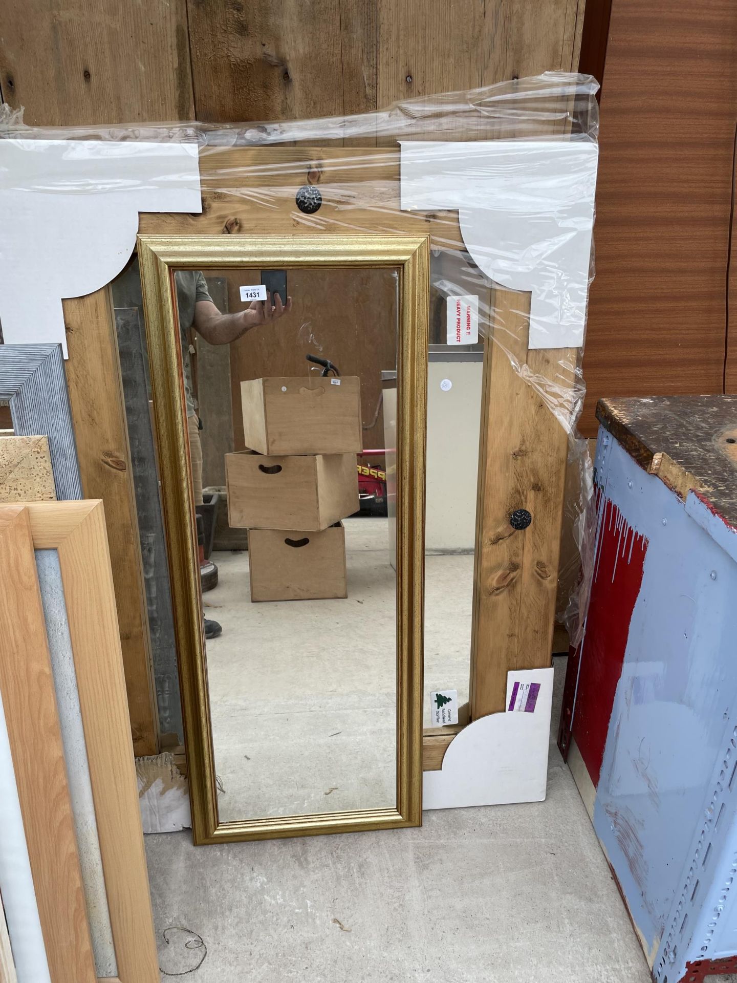 A LARGE PINE FRAMED MIRROR AND A FURTHER MIRROR