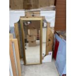 A LARGE PINE FRAMED MIRROR AND A FURTHER MIRROR