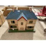 A VINTAGE WOODEN DOLLS HOUSE