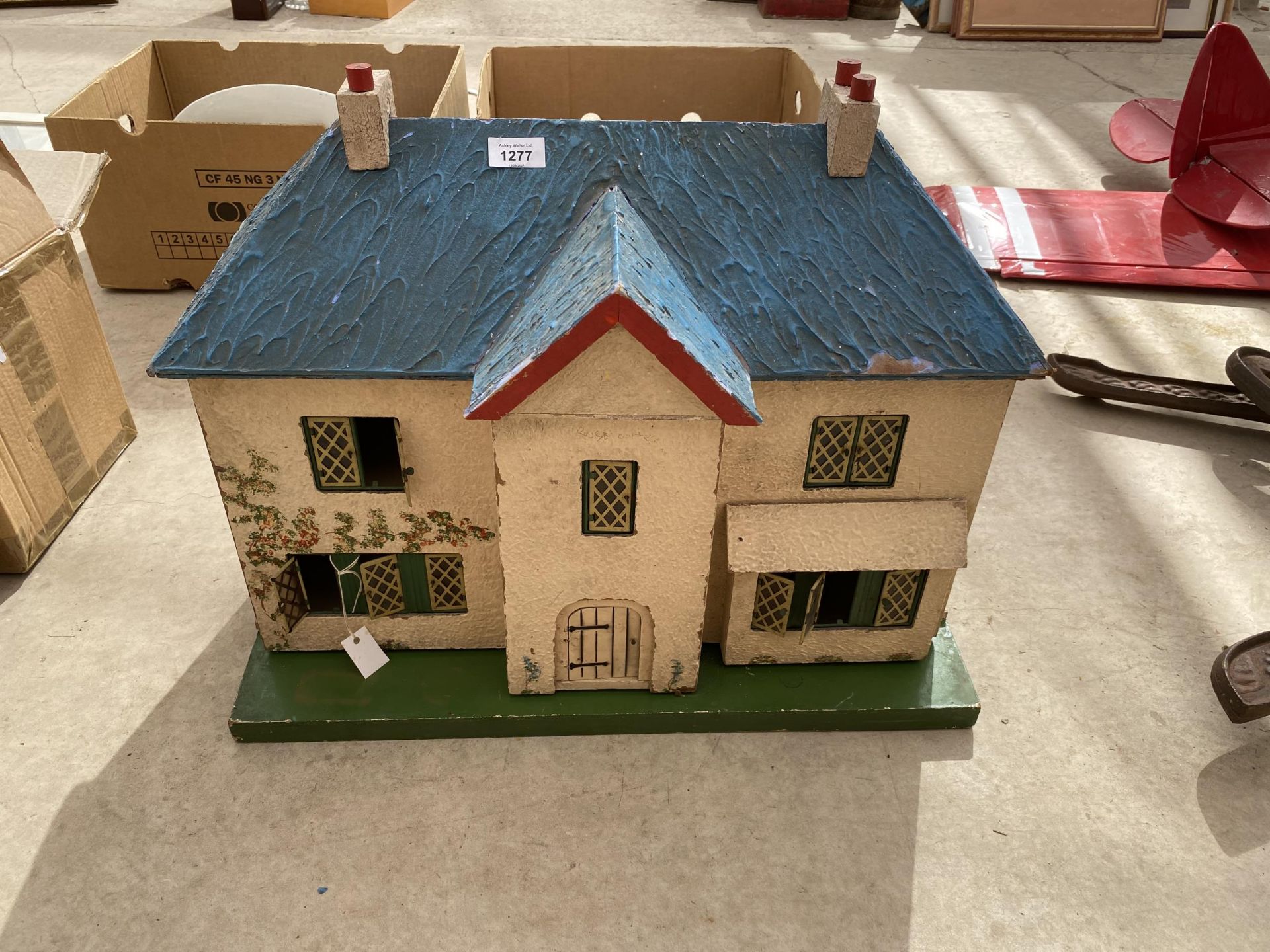 A VINTAGE WOODEN DOLLS HOUSE