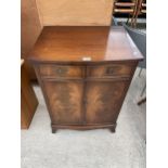 A REPRODUX BEVAN FUNNELL MAHOGANY BOW FRONTED STEREO CABINET 24" WIDE