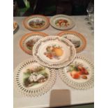 A COLLECTION OF SIX DECORATIVE PLATES AND A LARGER MATCHING ONE