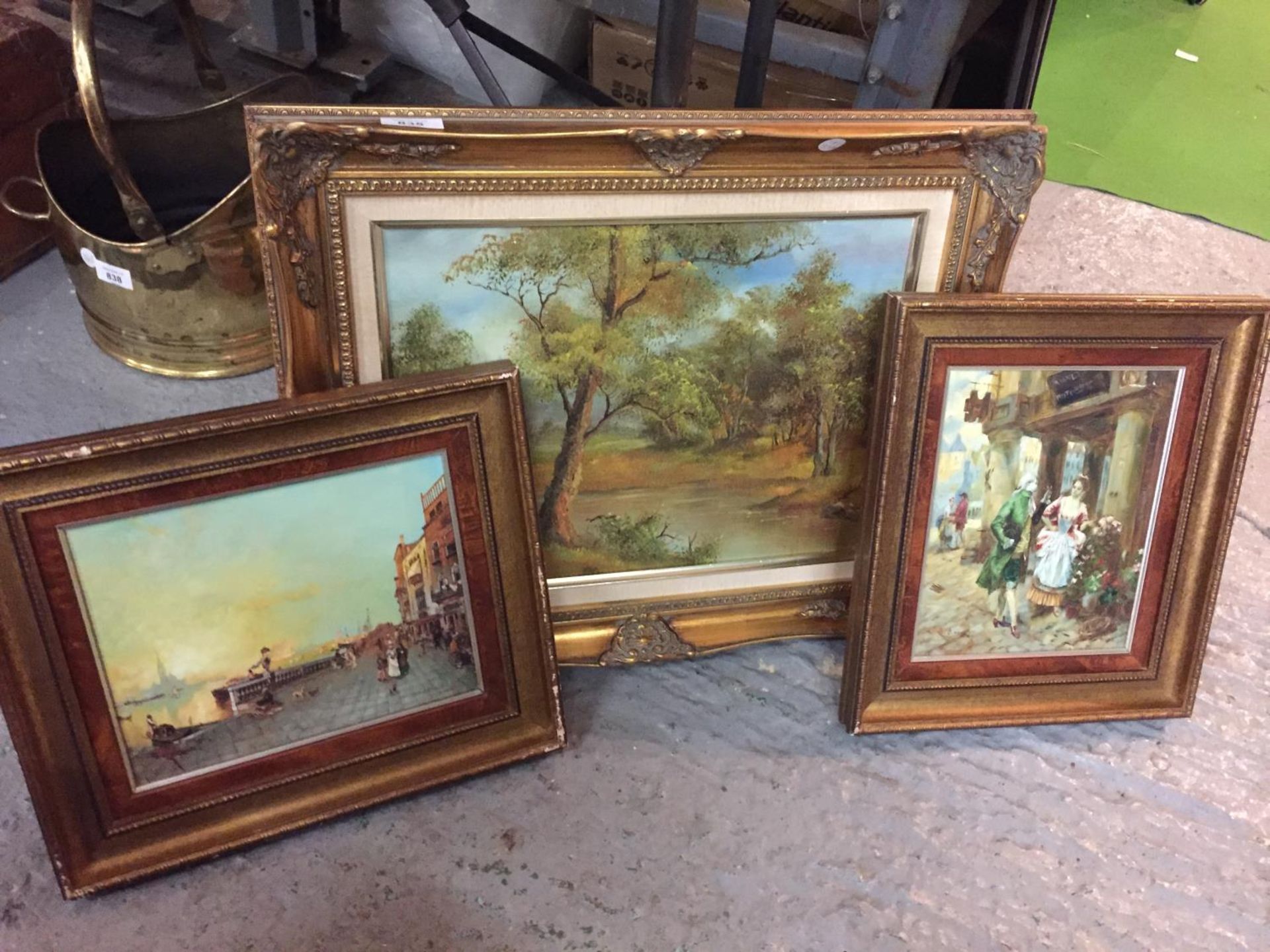THREE GILT FRAMED PAINTINGS OF LANDSCAPE AND TOWN SCENES